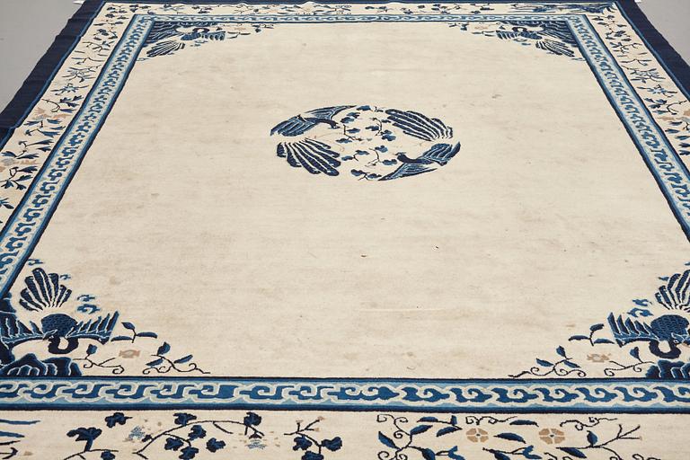 A carpet, a semi-antique China, ca 348,5-350 x 279,5-282,5 cm.