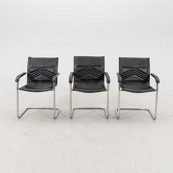 A set of five chrome and leather armchairs alter part of the 20th century.