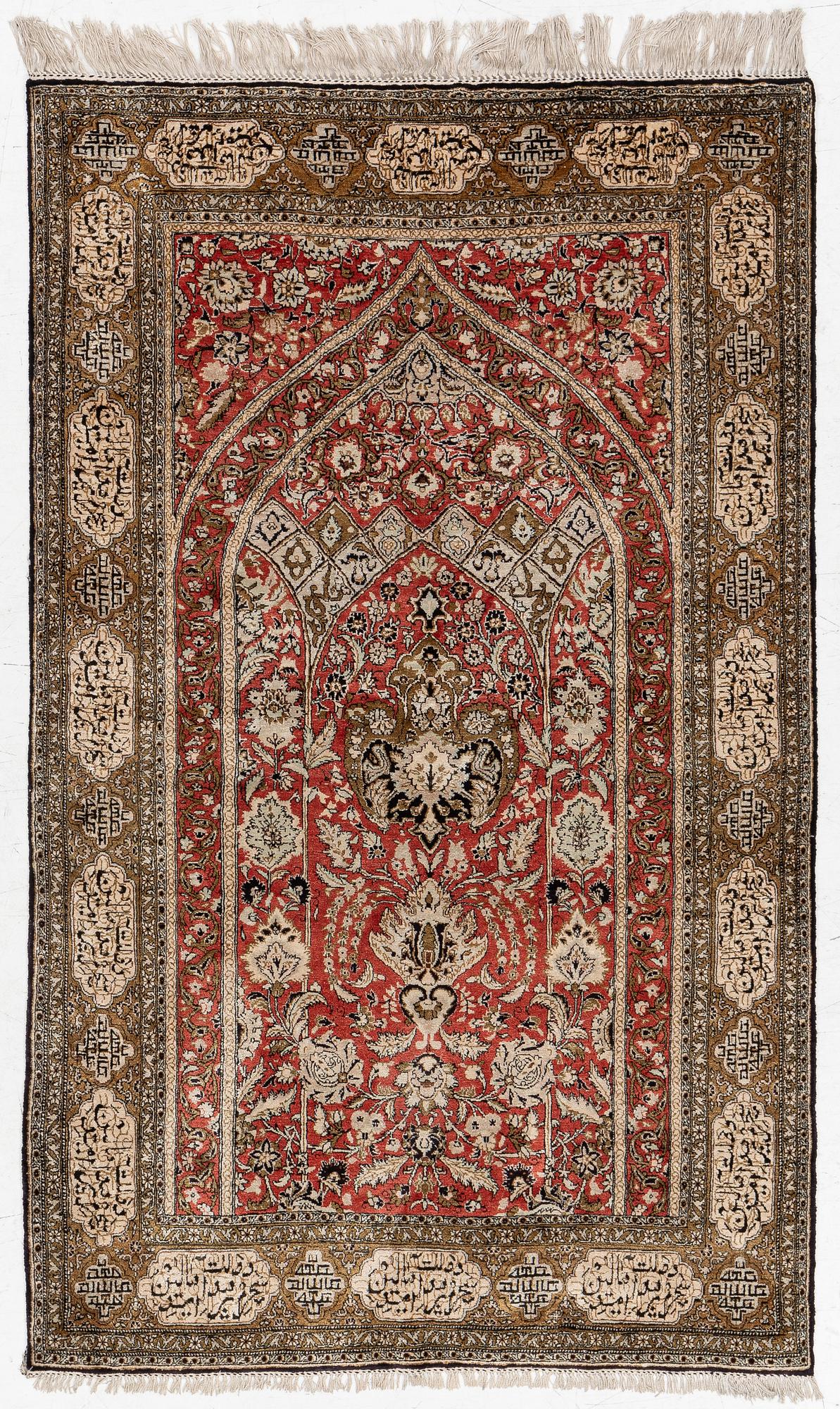 A silk Qum rug, c. 172 x 105 cm.