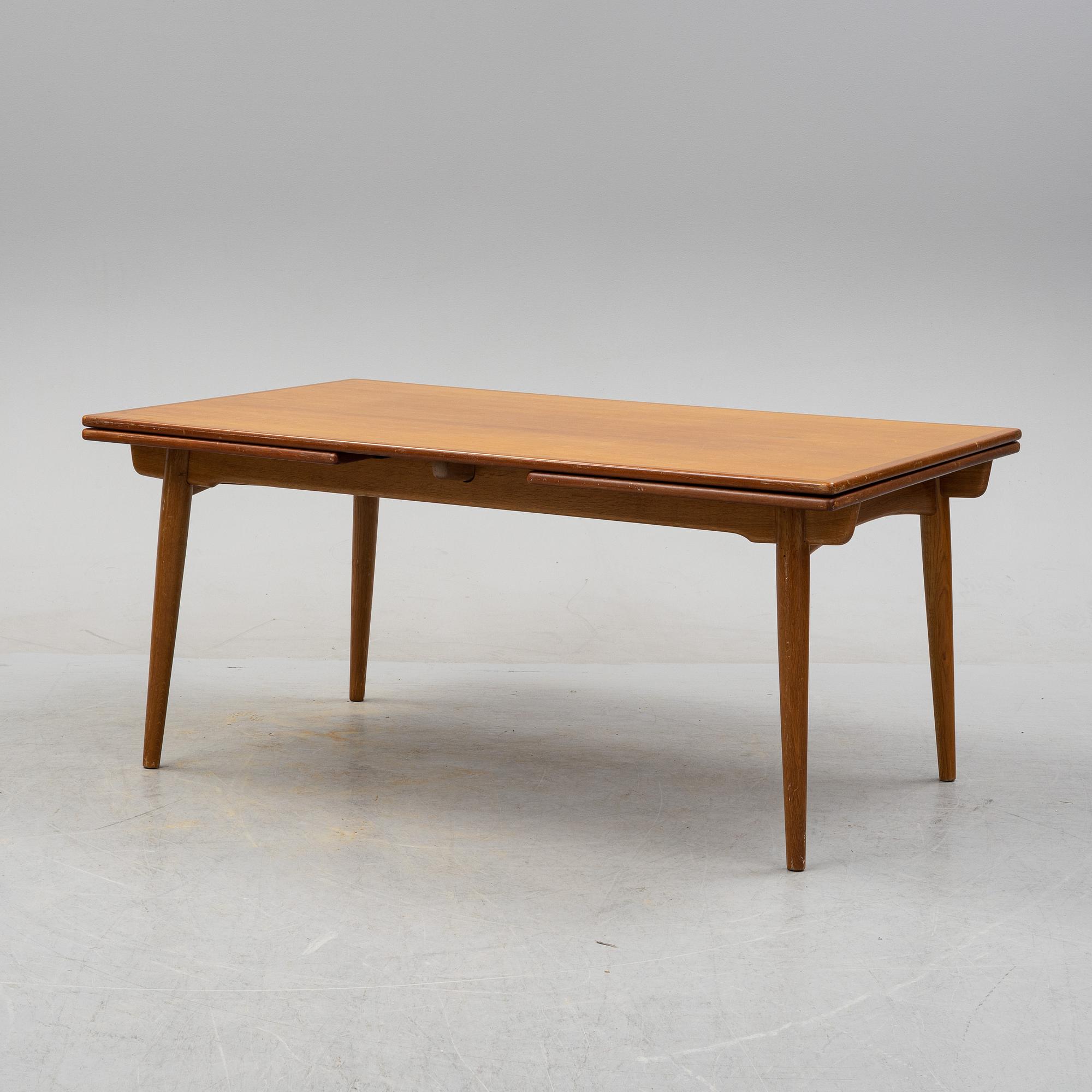Hans J Wegner, a model 'AT-312' teak veneered dining table, Andreas Tuck, Denmark.