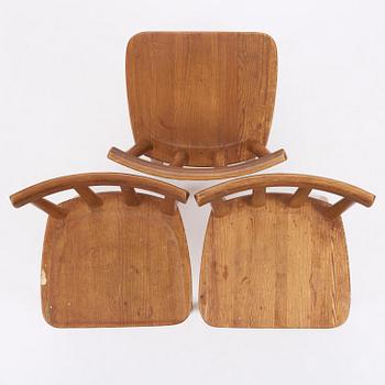 Axel Einar Hjorth, a set of three stained pine "Utö" chairs, Nordiska Kompaniet, Sweden, 1930s.