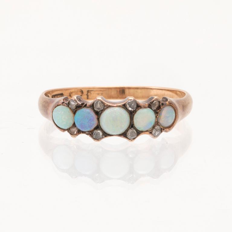 An 18K gold ring set with opals and rose-cut diamonds, Stockholm 1899.