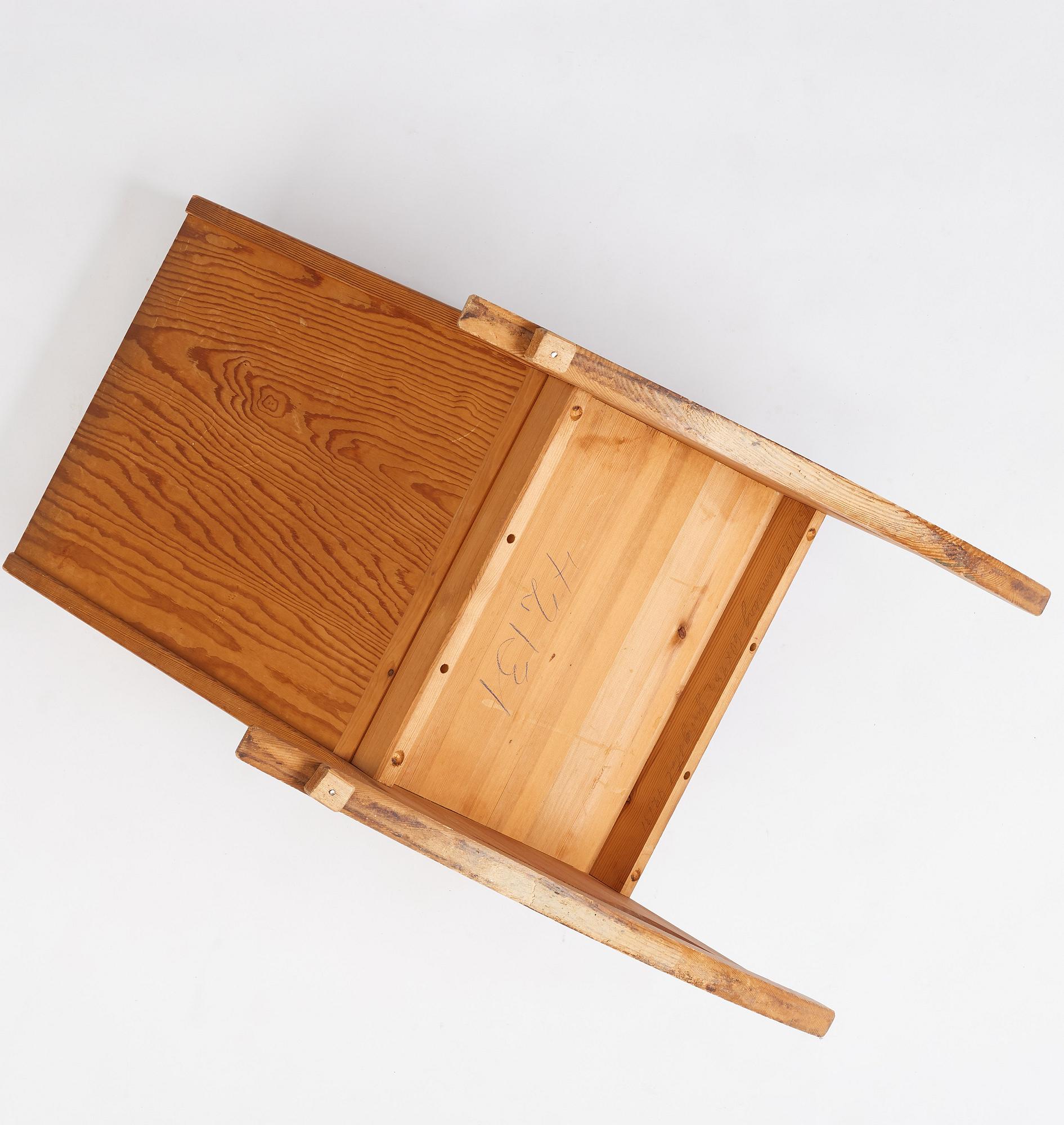 Nordiska Kompaniet, a Swedish Modern stained pine 'Lovö' rocking chair.