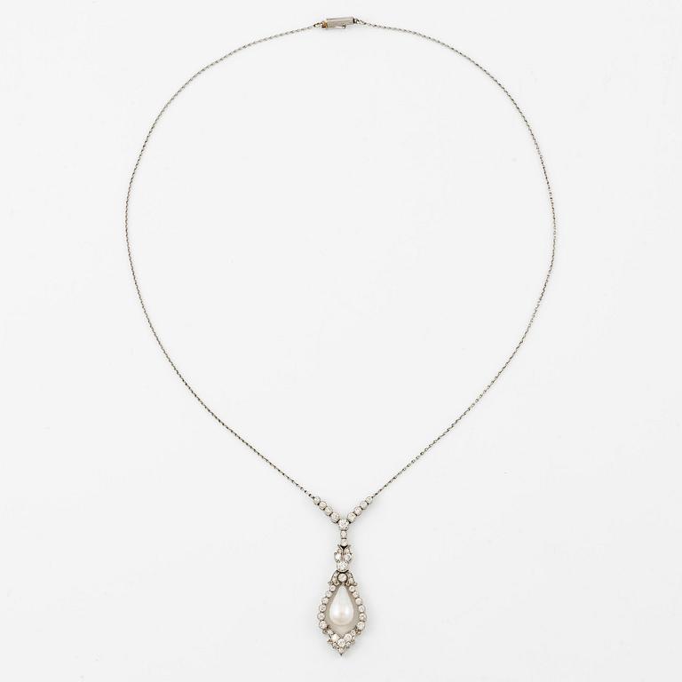 A platinum necklace with a drop-shaped pearl.