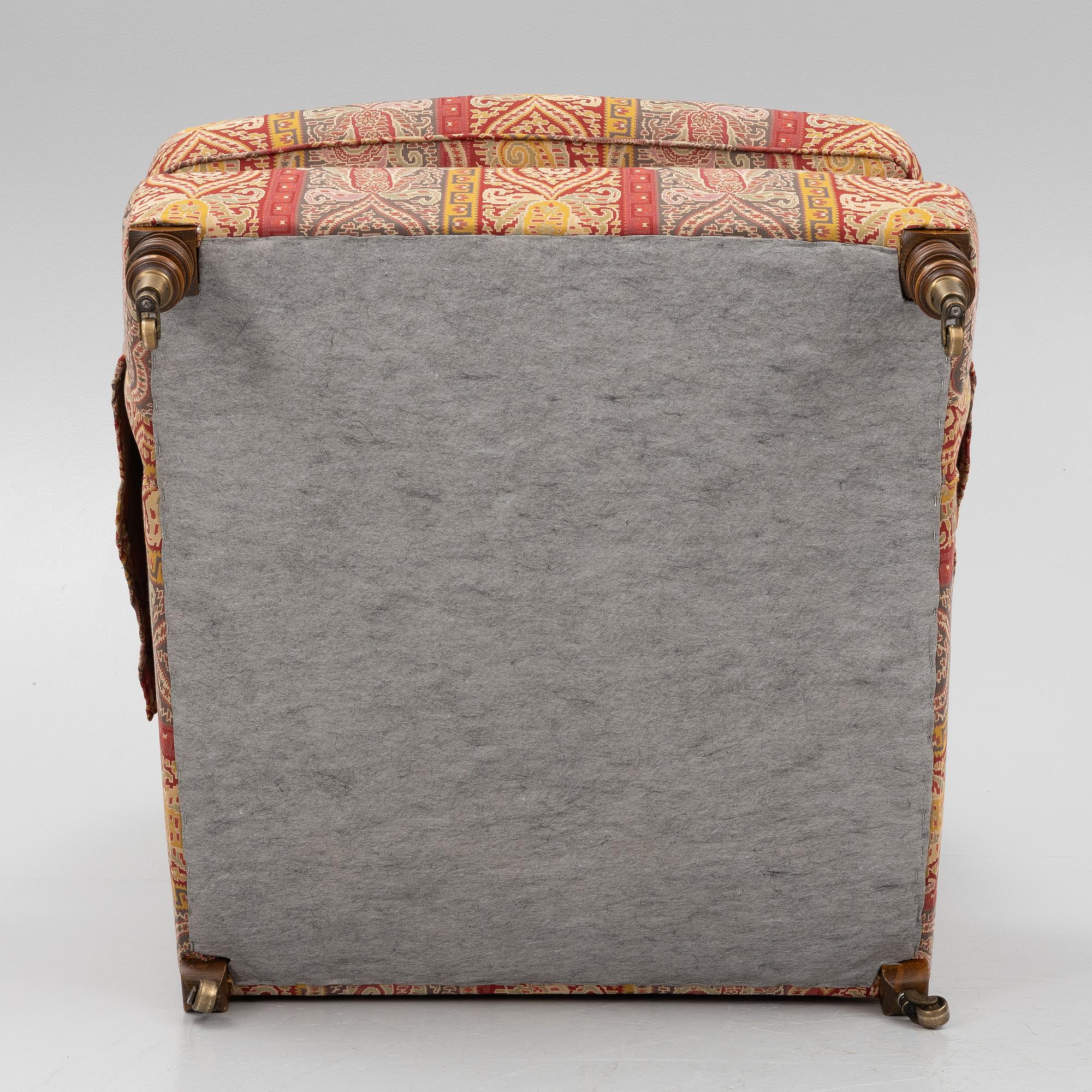 A Howard armchair with ottoman.