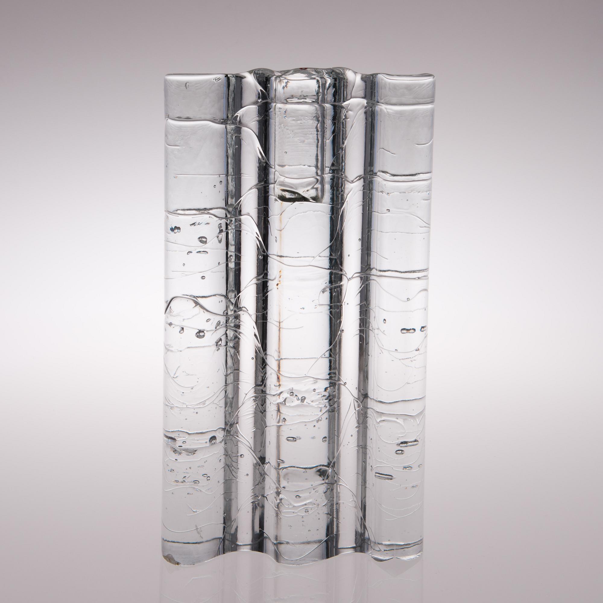 A glass sculpture / a set of three candlesticks, the Archipelago series. Signed Timo Sarpaneva.