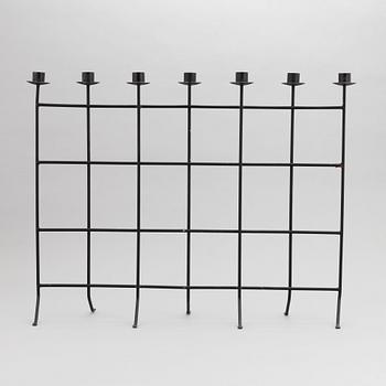 An iron candlestick, second half of the 20th Century.