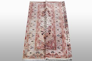 A carpet, Tabriz, part silk, 50 Raj, ca 340 x 253 cm.
