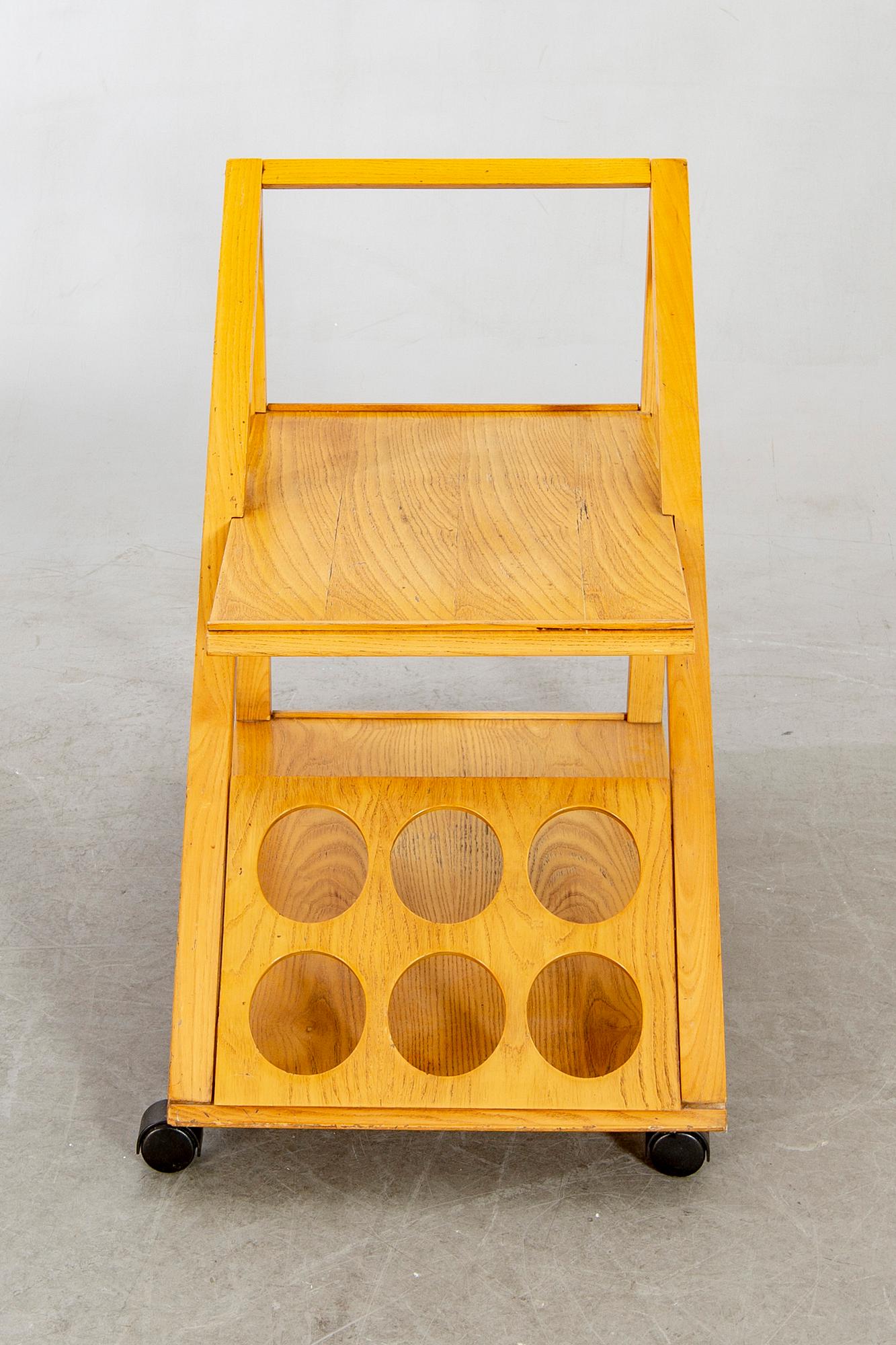 An Italian oak trolley later part of the 20th century.