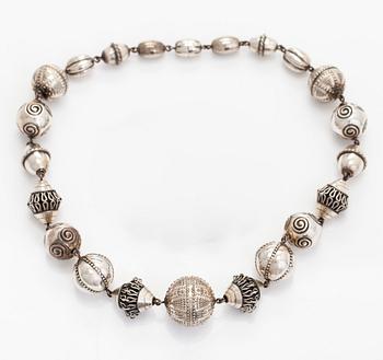 Kalevala Koru, a set of sterling silver "Halikko treasure" necklace, bracelet, ring and earrings. Helsinki 1994.