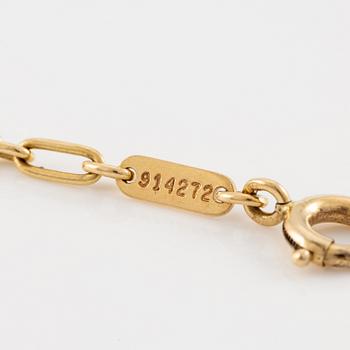 A Cartier necklace 18K multi-coloured gold "Trinity" cross.