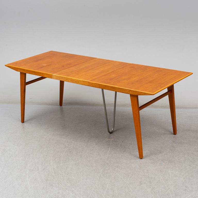 A second half of the 20th century teak and oak dining table.