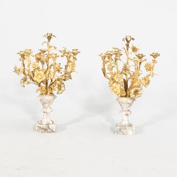 A pair of alabaster and gilded candelabras around 1900.