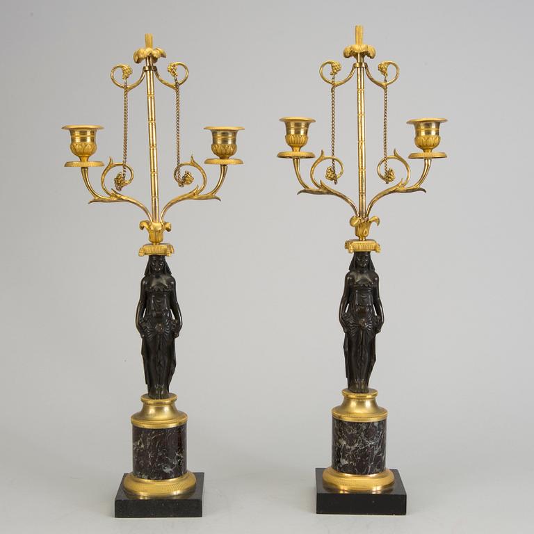 A pair of 1800s empire candelabras.