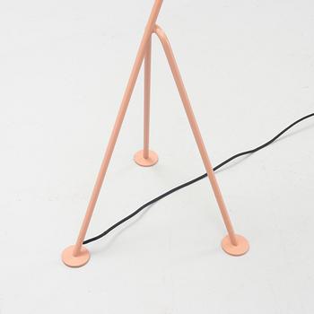 A 'Grasshopper' floorlamp by Greta Magnusson Grossman for Gubi.