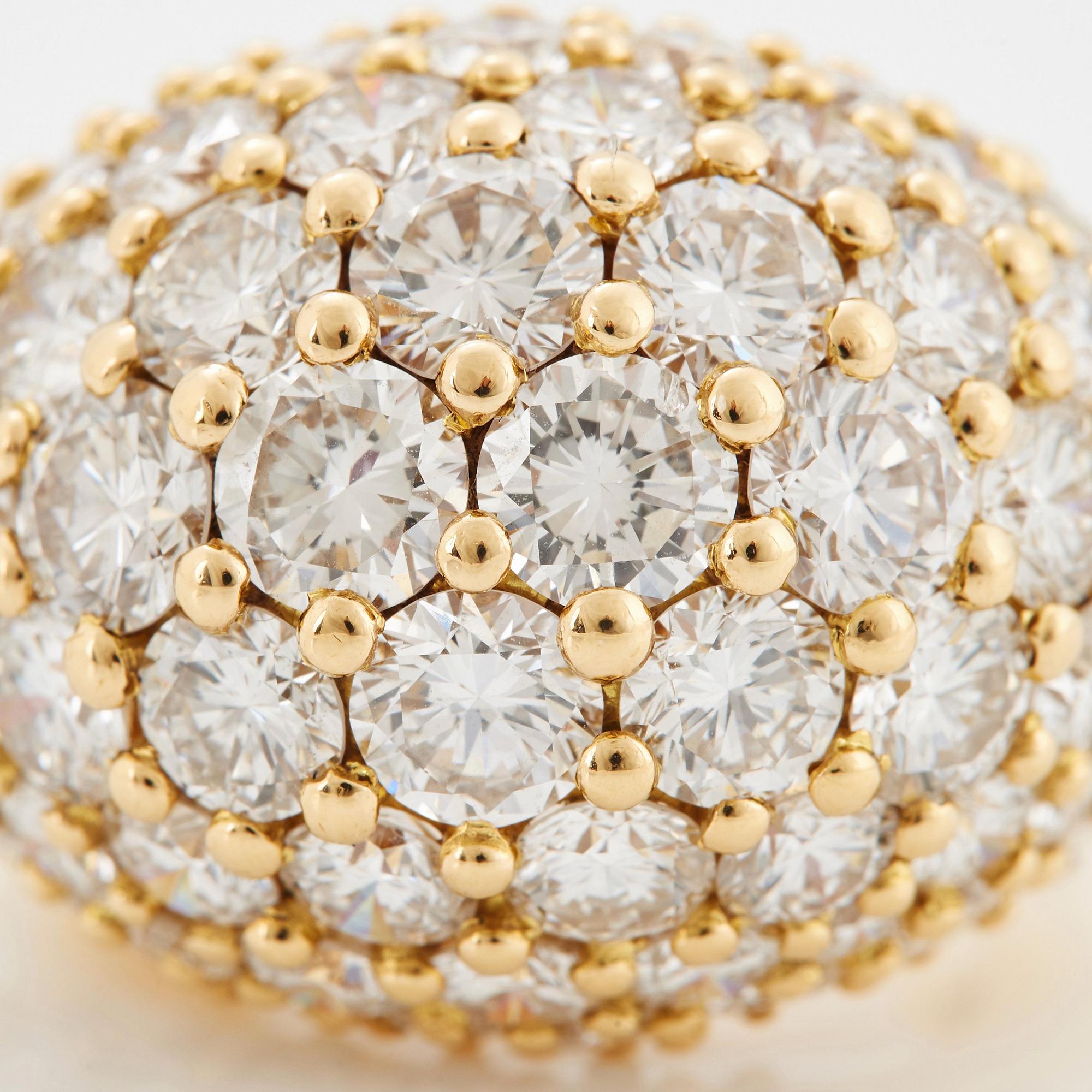 Cartier "Marrakech" an 18K gold bombé ring set with round brilliant-cut diamonds.