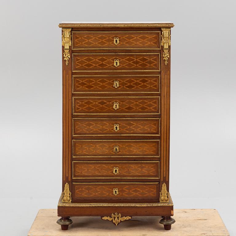 A Louis XVI-style chest of drawers, circa 1900.