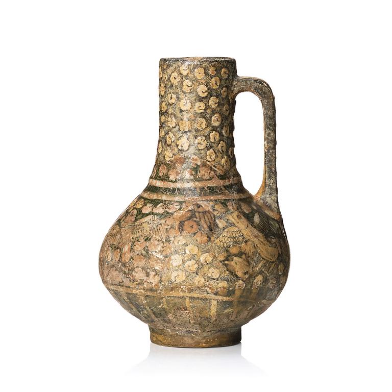 A central or northern persian pottery jug, probably 13th to 14th century.