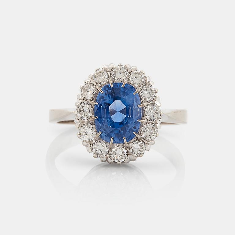 An 18K whithe gold ring set with a faceted sapphire weight 3.93 cts according to engraving.