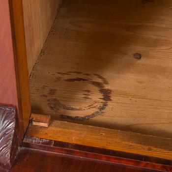 A mahogany veneered cabinet from around year 1900.