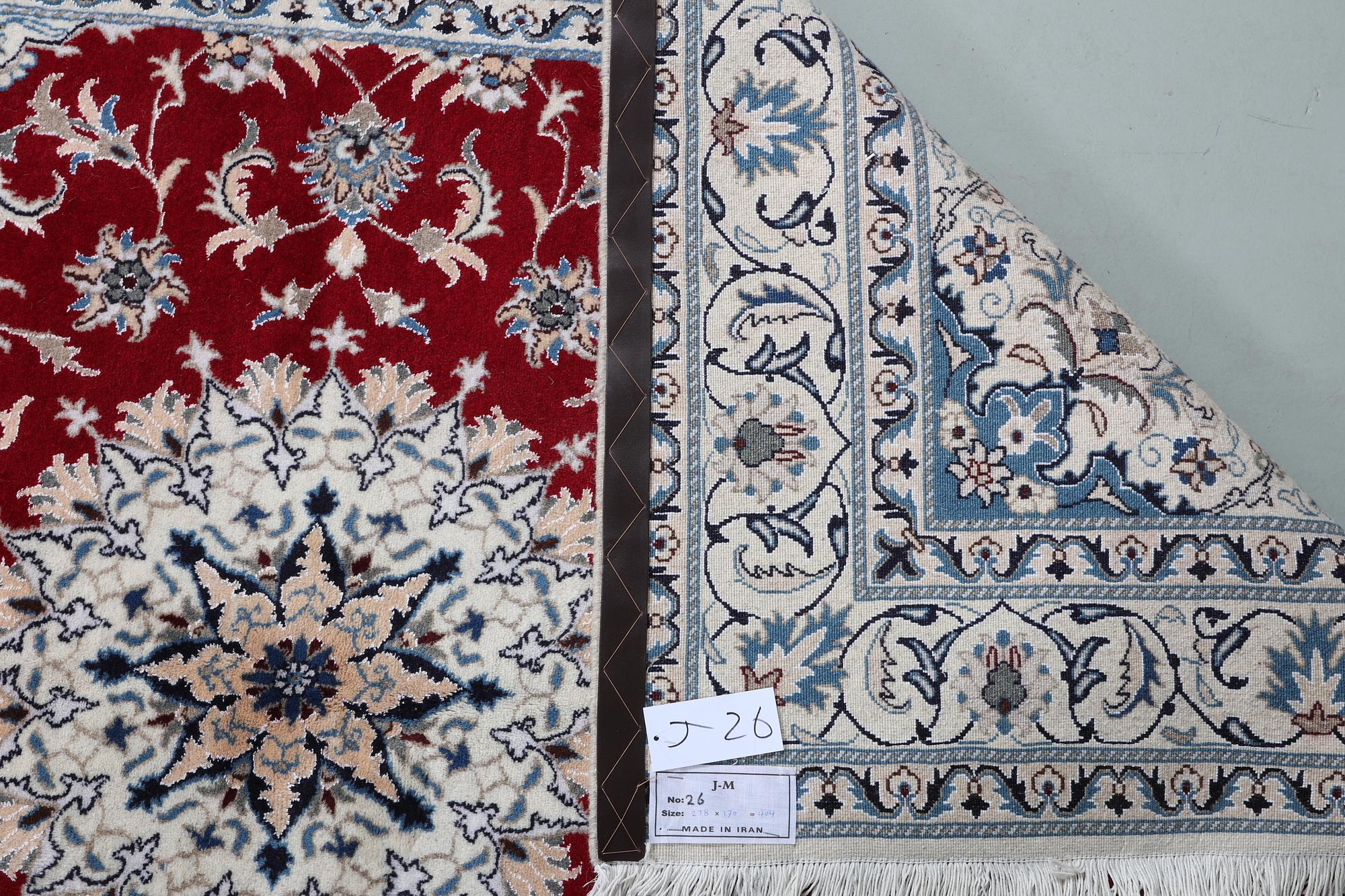 A carpet, Nain, part silk, ca 238 x 170 cm.