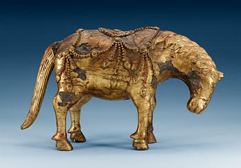 1498. A gilt-lacquered wood sculpture of a horse, Qing dynasty, 17th/18th Century.
