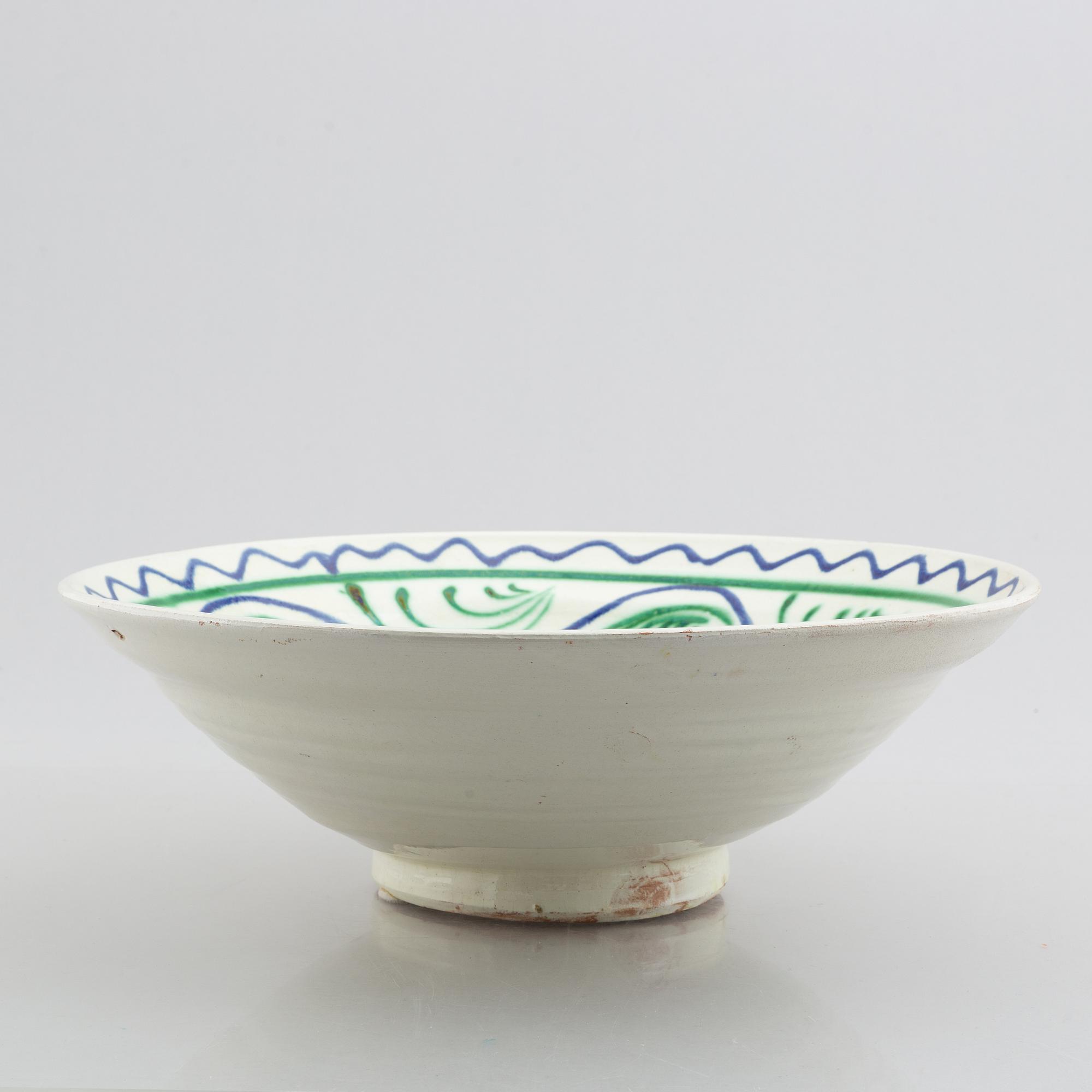 A faience bowl, circa 1900.