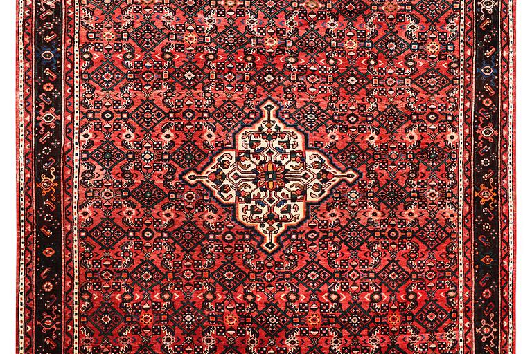 A carpet, Hosseinabad, c. 303 x 218 cm.