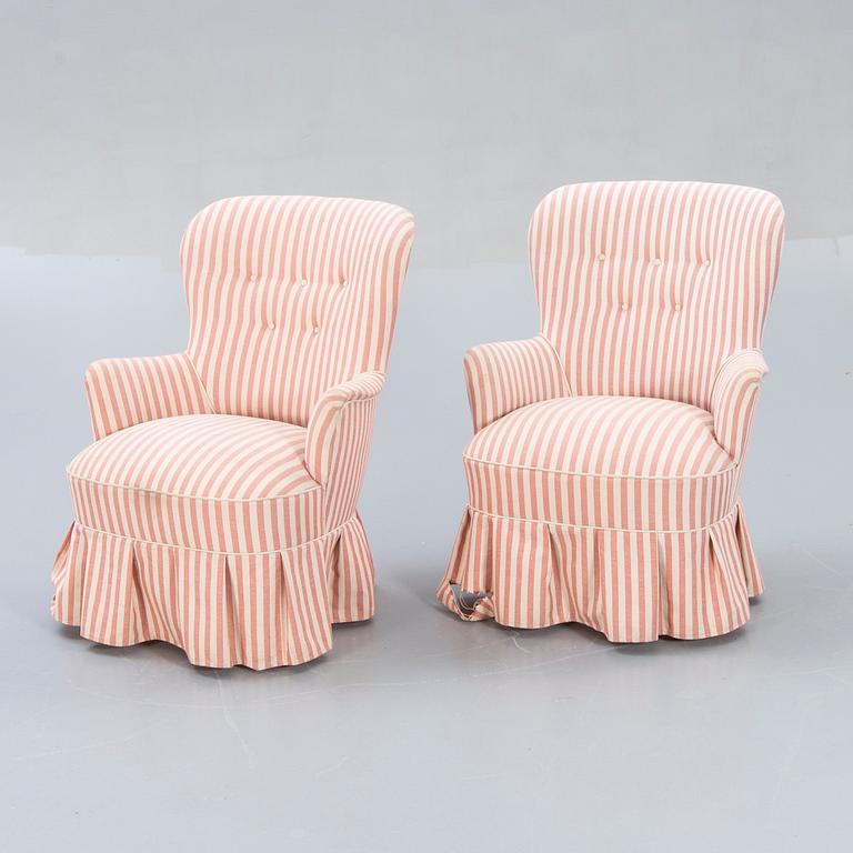 A pair of Modern easy chairs.