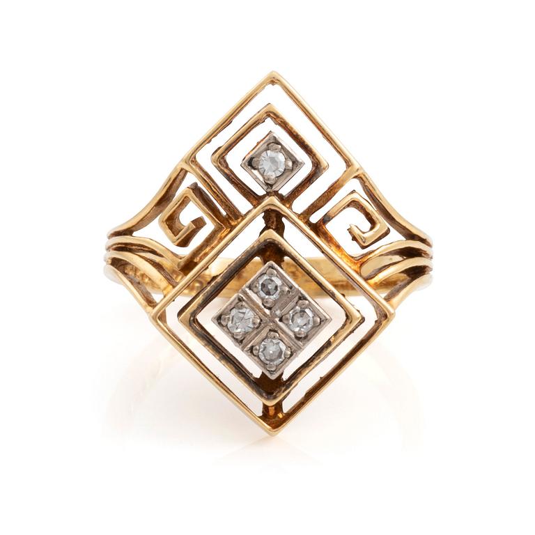 An Ilias Lalaounis ring in 18K gold set with eight-cut diamonds.