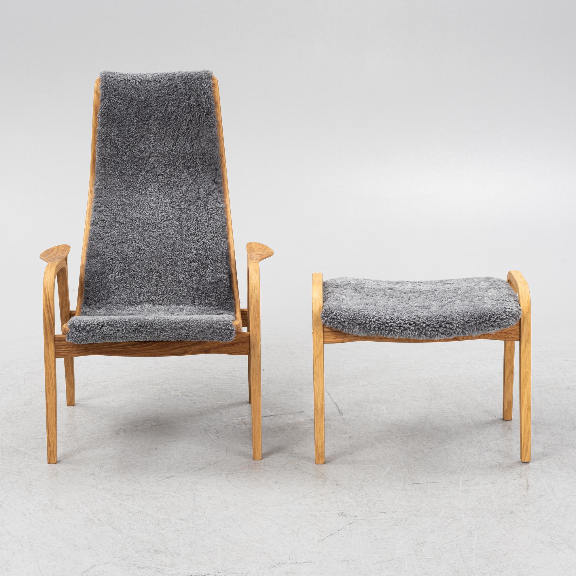 An Yngve Ekström armchair with footstool, "Lamino", Swedese, 21st century.