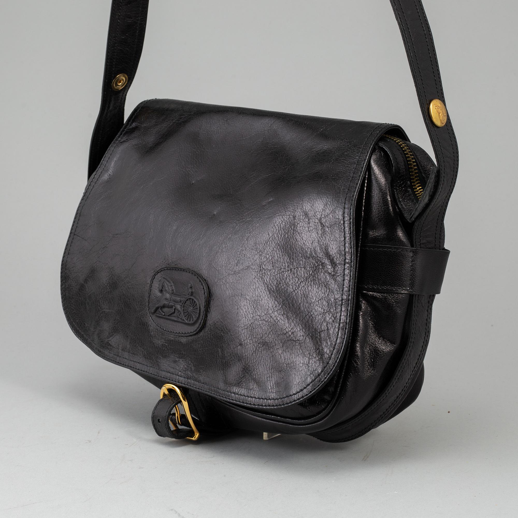 CÉLINE,a black leather handbag.