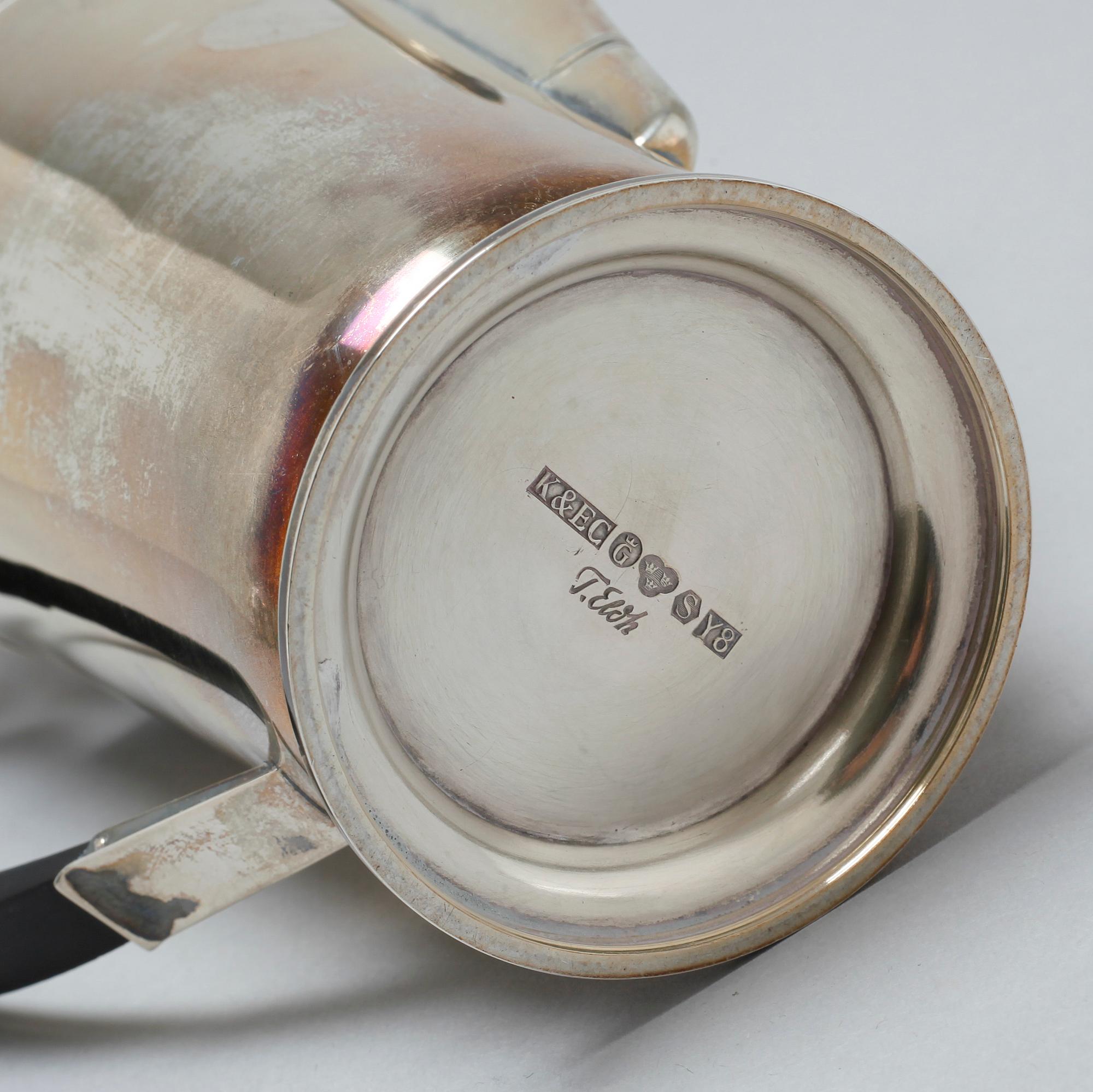 A silver coffee pot, sugar bowl and creamer by Thore Eldh for K&EC in Göteborg, 1949.