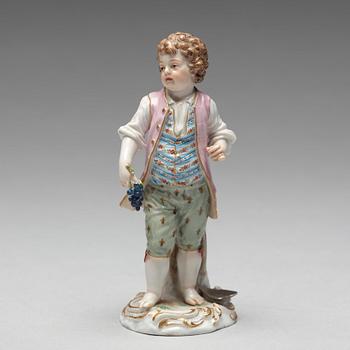 A Meissen figure of a young boy with grapes, 1890's.