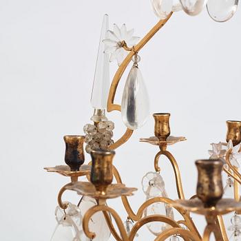 A Louis XV-style rock crystal eight-light chandelier, 20th century.