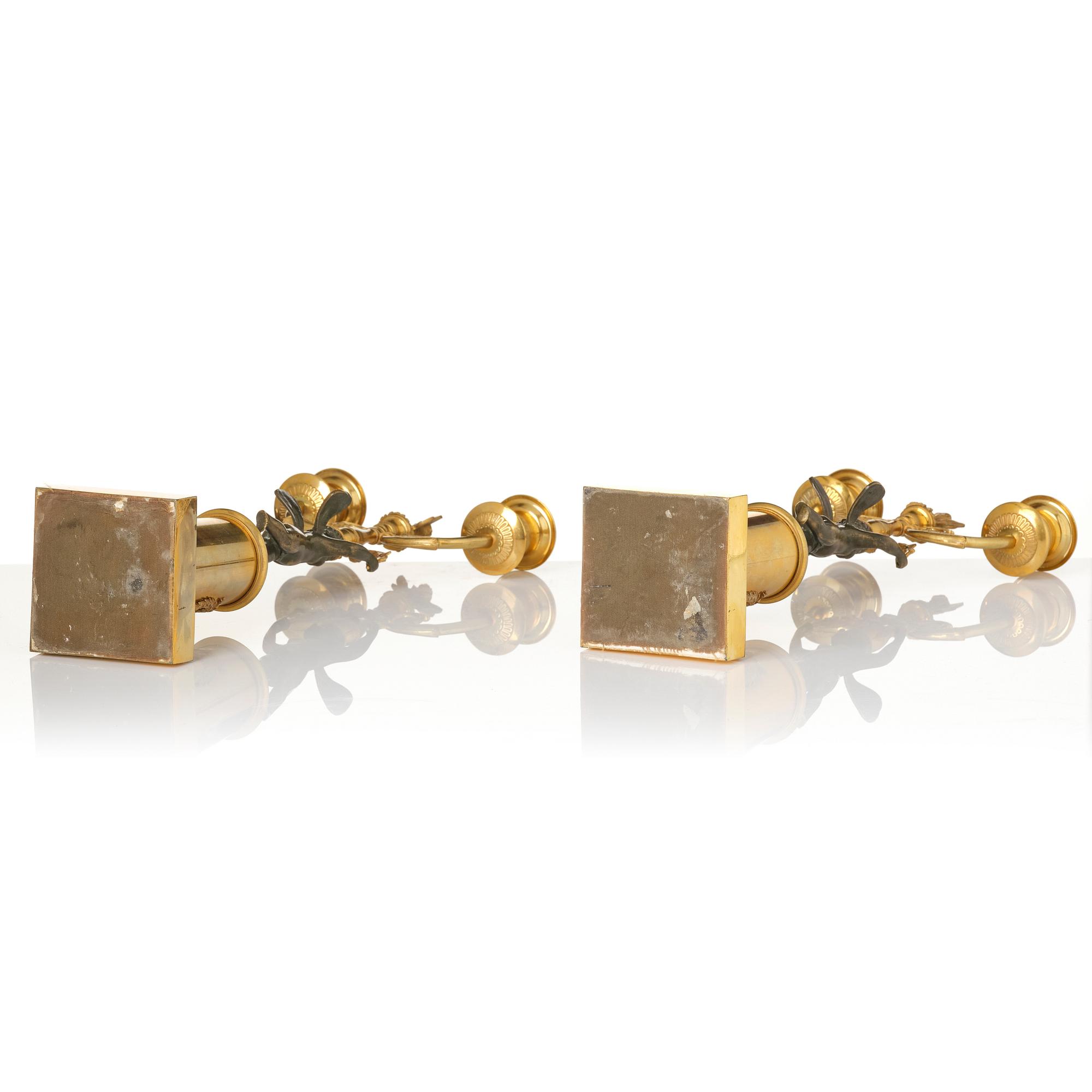 A pair of Empire gilt-brass two-branch candelabra, Stockholm, early 19th century.