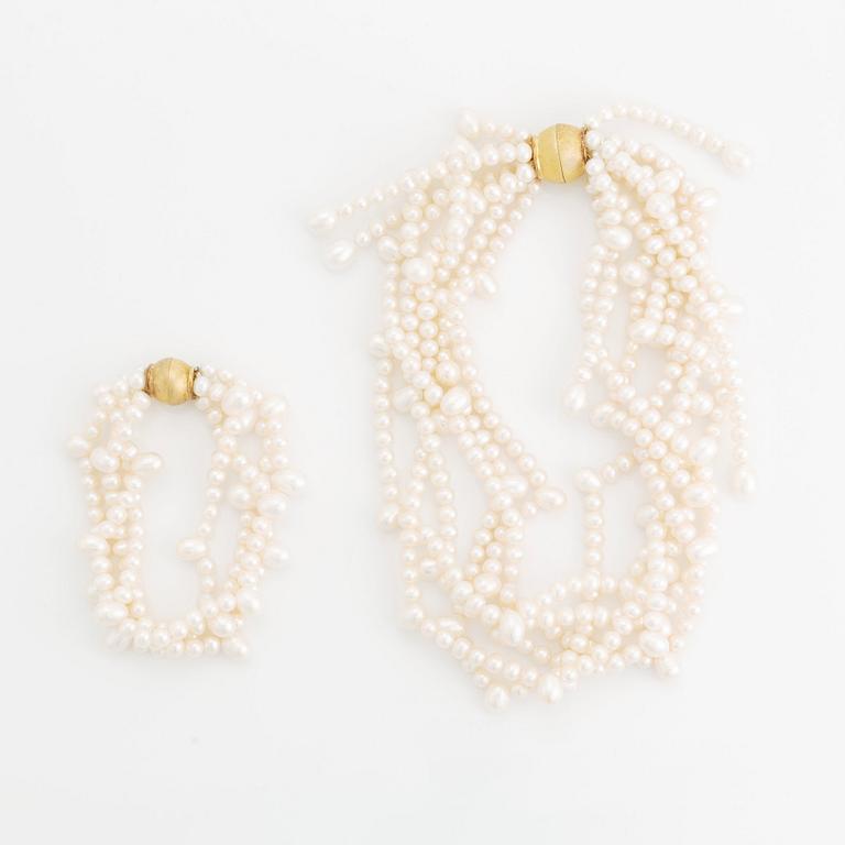 A cultured freshwater pearl necklace and bracelet.