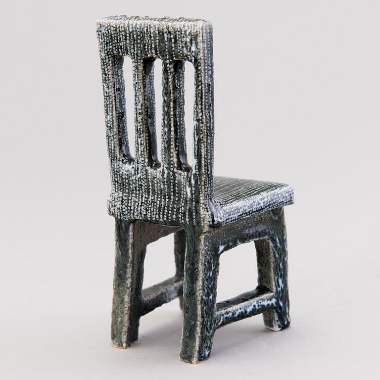 HEINI RIITAHUHTA, a porcelain miniature sculpture 'Chair' signed Heini Riitahuhta.