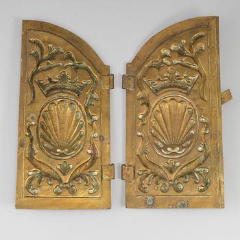 A pair of art nouveau brass oven hatches, early 20th century.