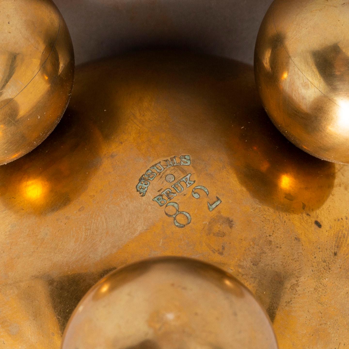 A pair of brass candlesticks from Gusum, circa 1900.