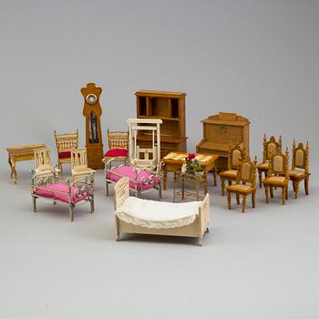 A doll house with interior and dolls ca 1910.