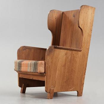 An Axel Einar Hjorth 'Lovö' stained pine armchair, Nordiska Kompaniet, Sweden 1930's.