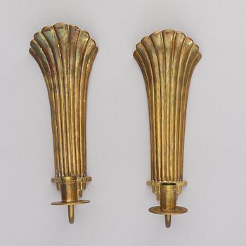 Lars Holmström, a pair of Swedish Grace brass wall sconces, Arvika, 1920's.