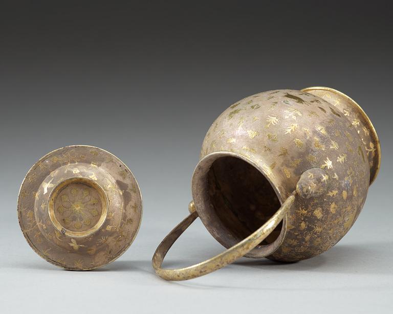 A gilt silver jar with cover and handle, presumably Tang dynasty.