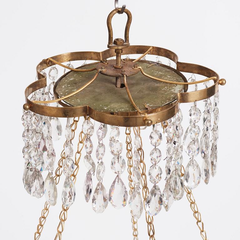 A late Gustavian gilt-brass and green glass six-light chandelier, late 18th century.