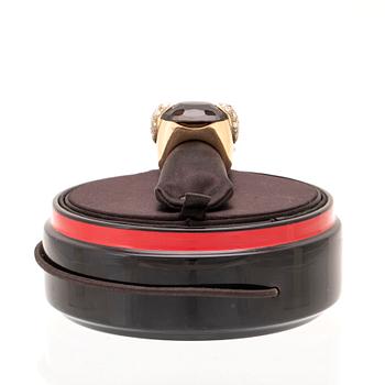 An 18K gold Pomellato "Pin Up" ring set with smoky quartz and round brilliant-cut diamonds.