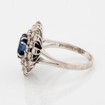 A sapphire and brilliant cut diamond ring.