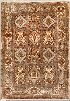 A semi-antique figural Kaysari silk carpet, approx. 100 x 70 cm.