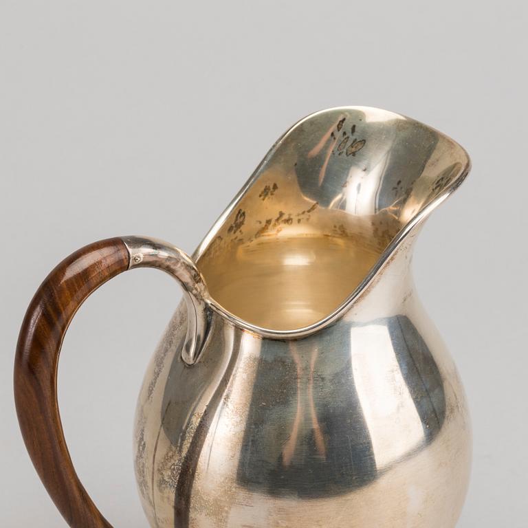 A Swedish 20th century sterling jug mark of Nordisk silverkonst Helsingborg 1948, total weight 347 gr.