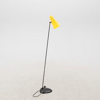 A 1050s metal and plastic floor lamp.